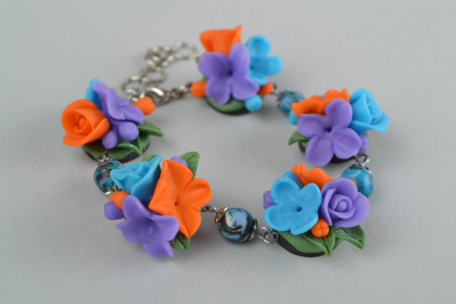 Handmade stylish wrist bracelet with flowers made of polymer clay on metal chain photo 1