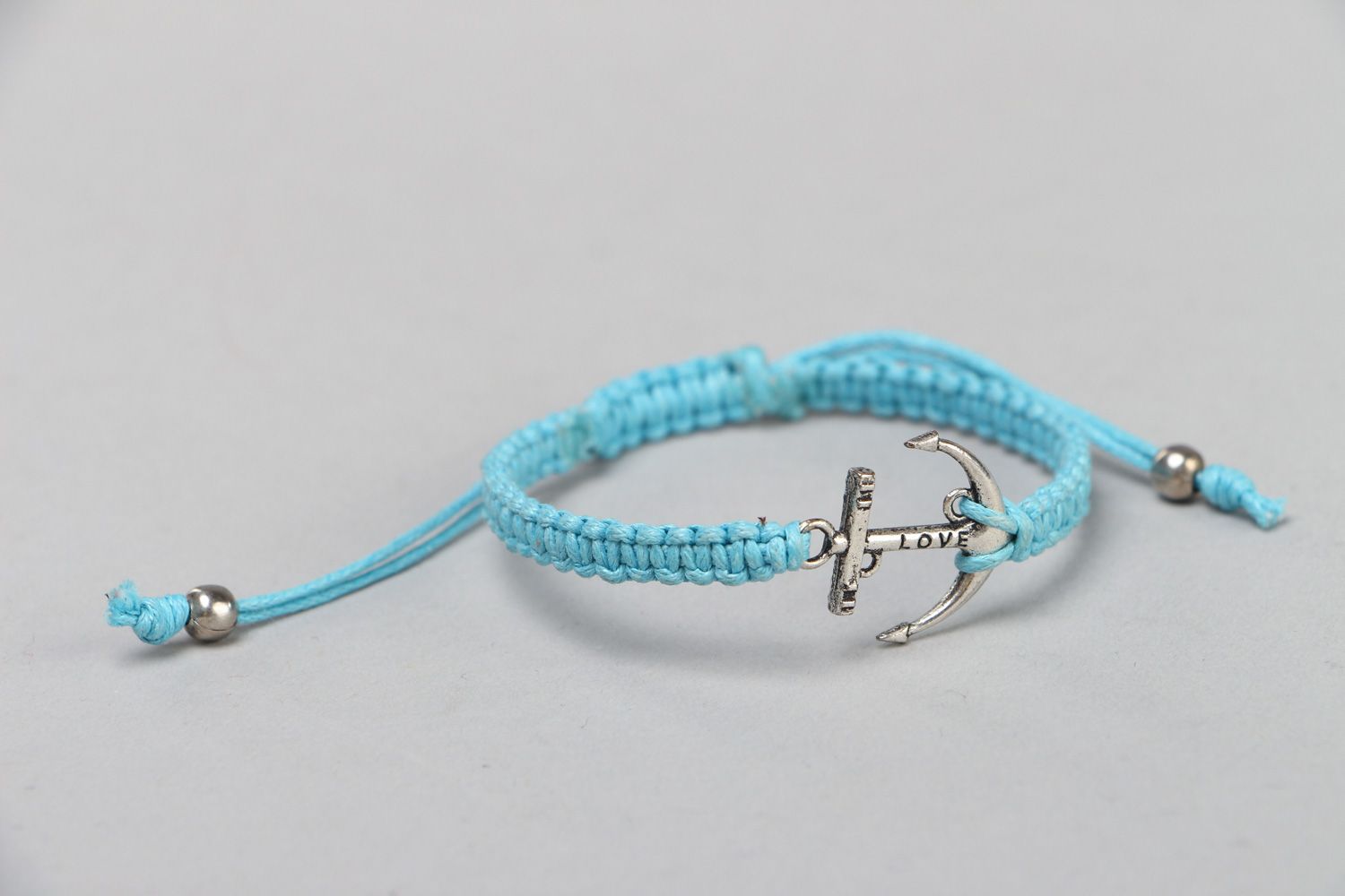 Handmade waxed cord wrist bracelet of blue color with metal charm Anchor for women photo 1