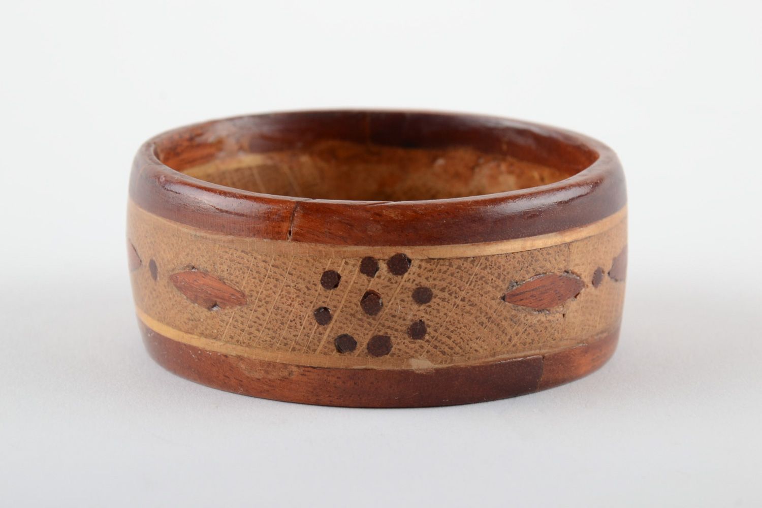 Handmade wrist bracelet carved of wood with inlay tinted and coated with varnish photo 1