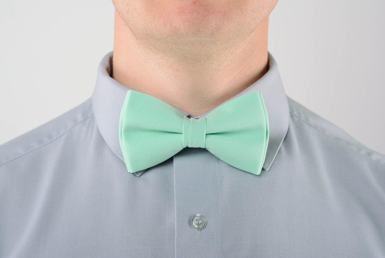 Mintgrüne Fliege Krawatte aus Textil foto 1
