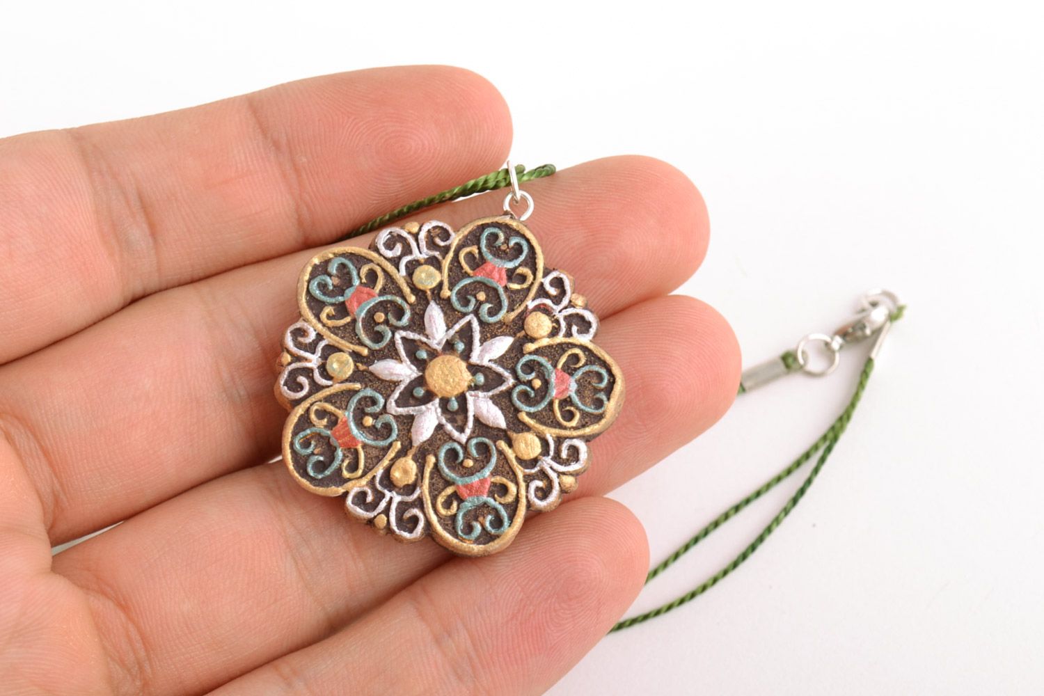 Homemade clay pendant of flower shape painted with lacy ornament with acrylics photo 2