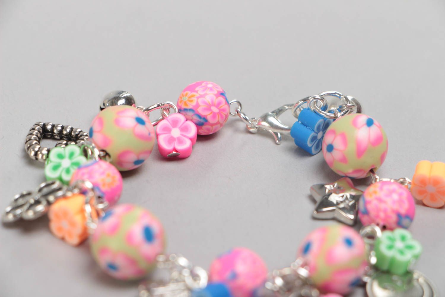 Handmade designer children's pink wrist bracelet with plastic and acrylic beads photo 4