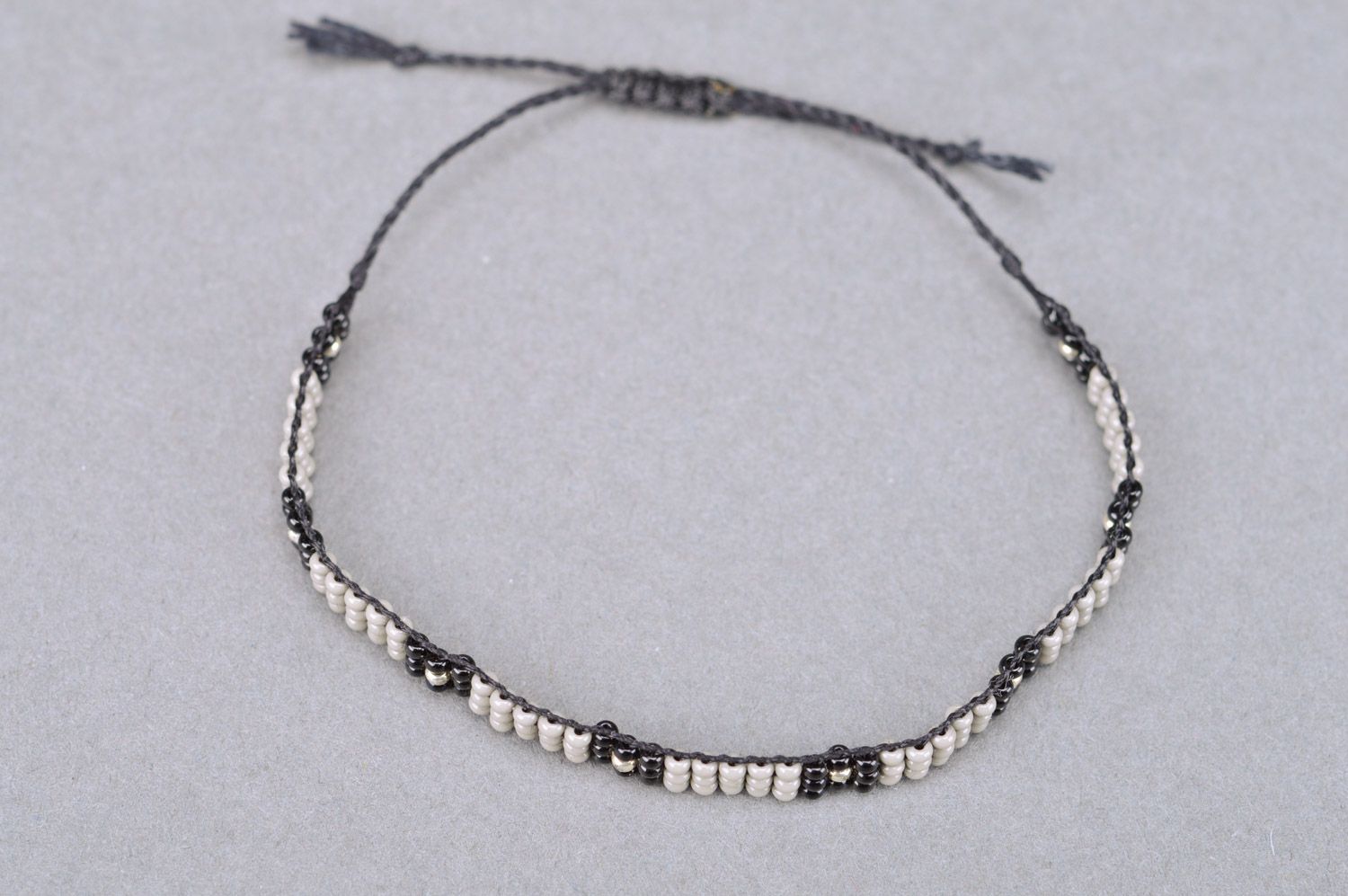 Beautiful black and gray thin beaded bracelet with ties for men photo 2