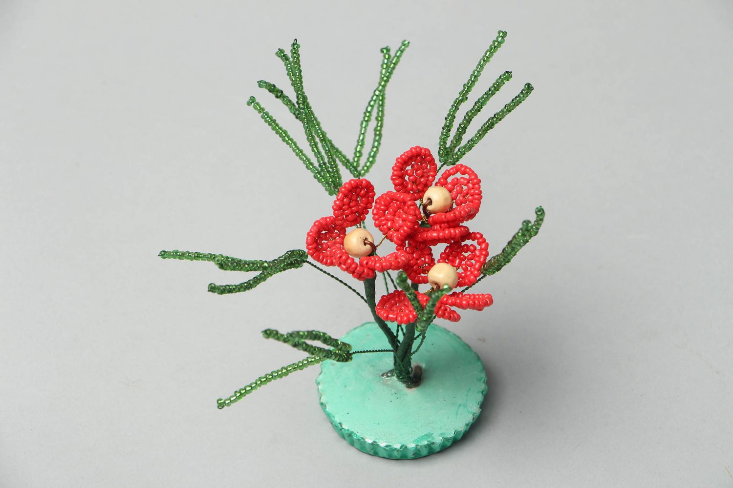 Decorative beaded flower composition of red color photo 2