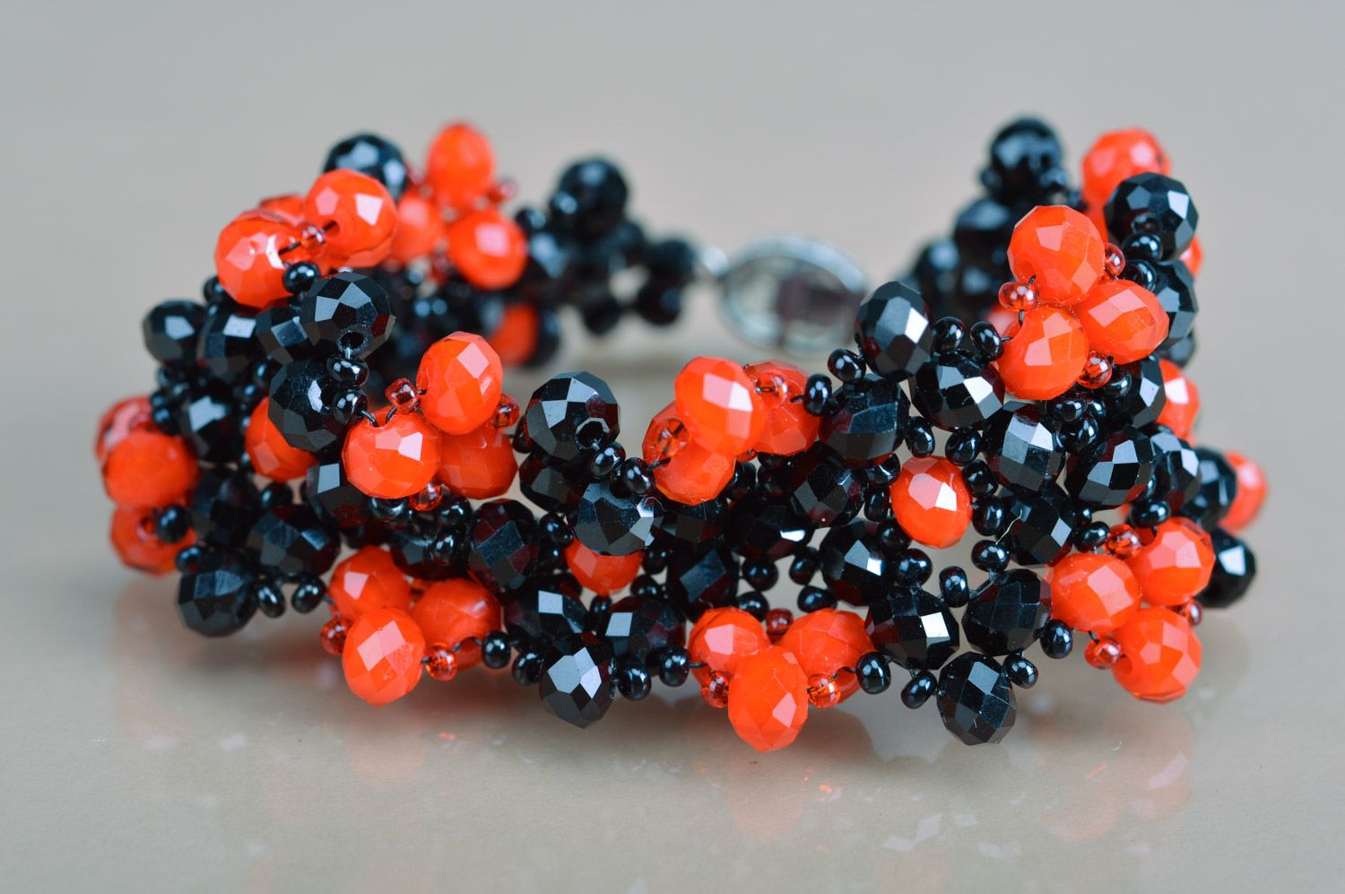 Handmade beautiful wrist bracelet woven of red and black agate and coral beads photo 2