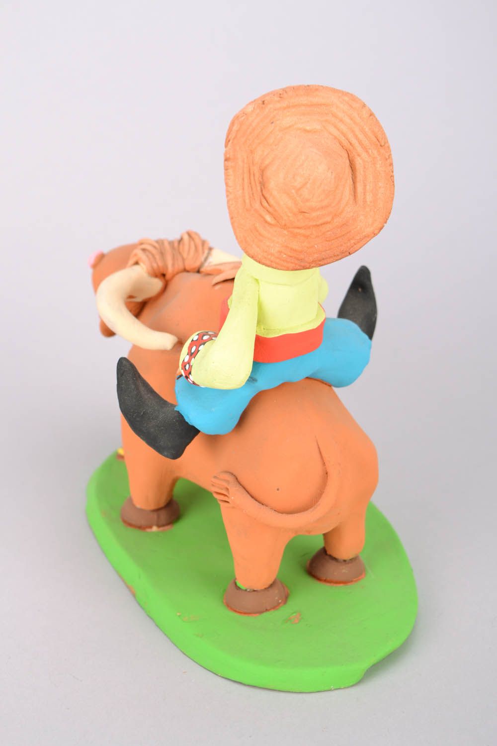 Homemade clay statuette Cossack riding a bull photo 5