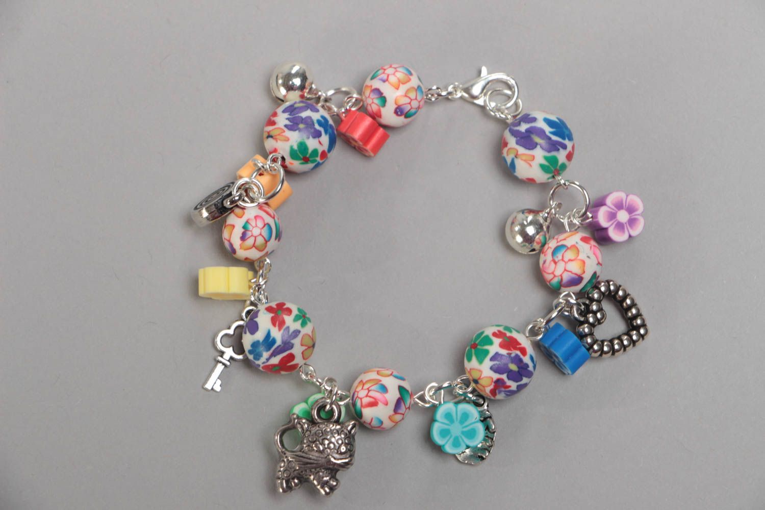 Beautiful eye-catching children's handmade plastic bracelet with charms photo 3