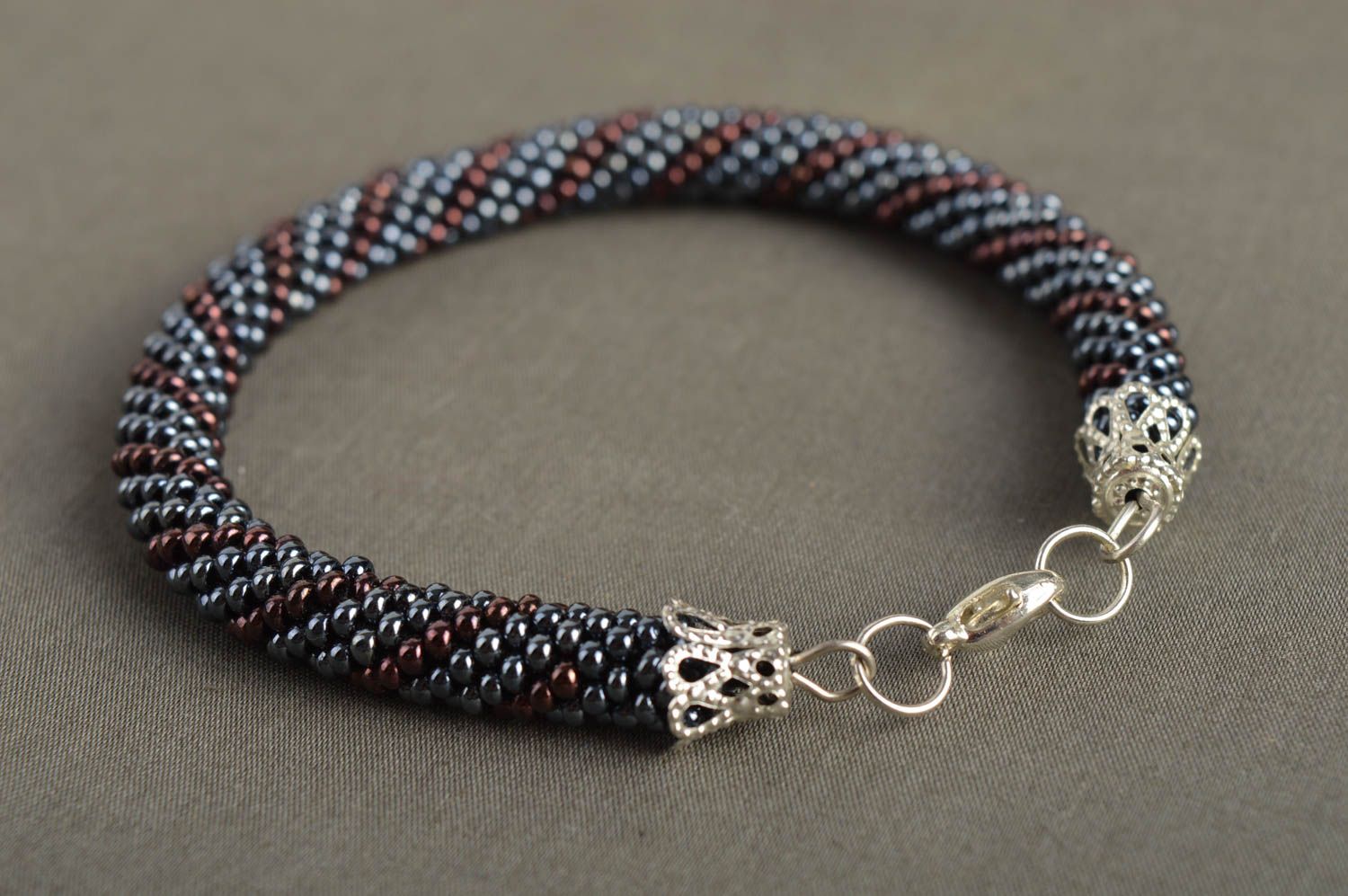 Handmade beaded cord bracelet in silver and dark cherry color photo 1