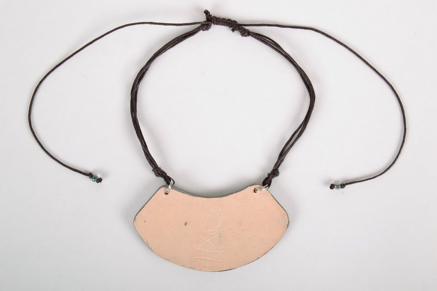 Ceramic pendant with a cord photo 2