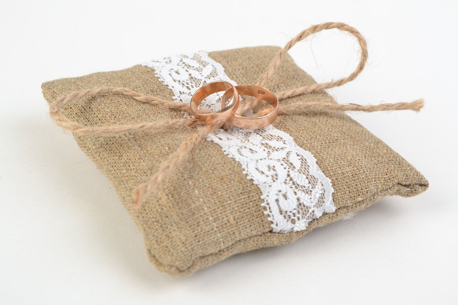 Handmade ethnic rings bearer pillow sewn of burlap with white lace and cord  photo 1
