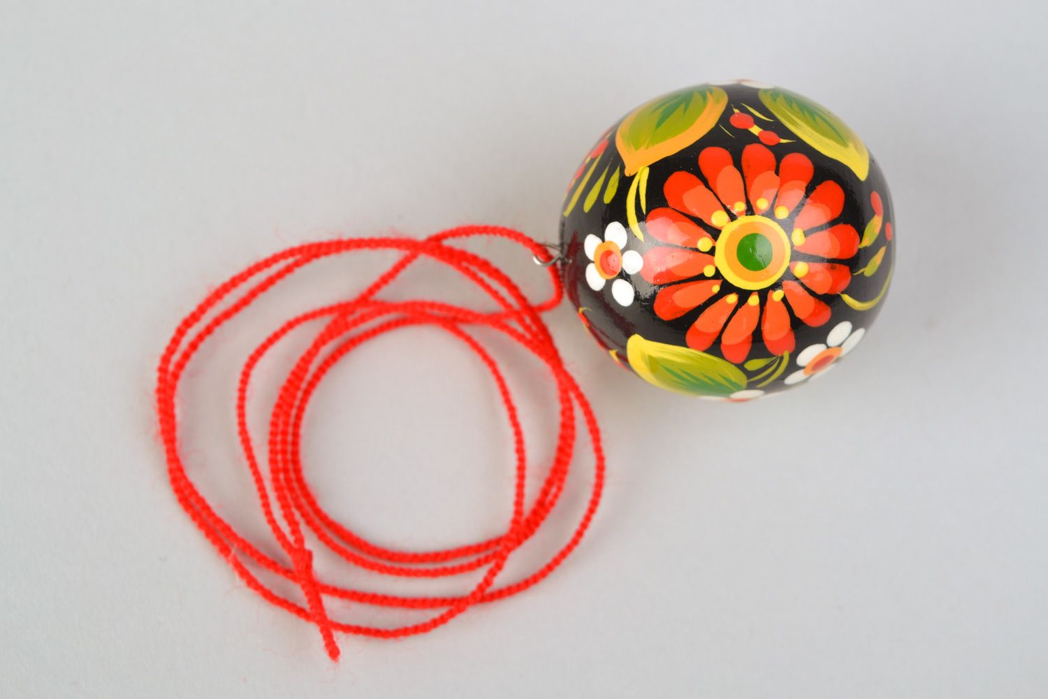 Handmade round wooden pendant with Petrikivka painting in Ukrainian style on cord photo 4