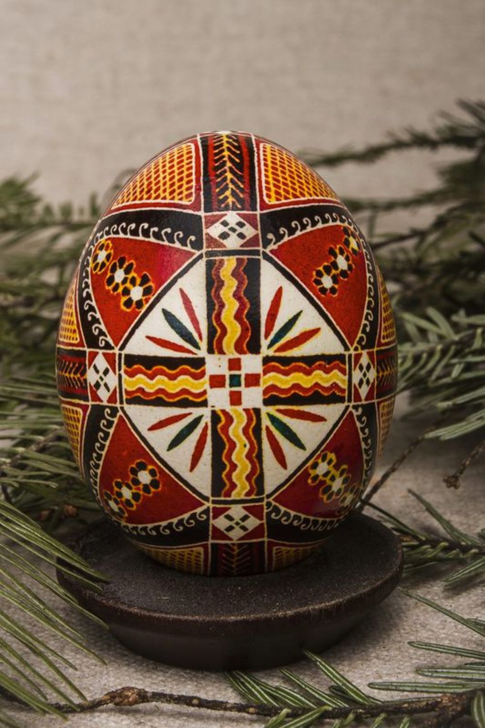 Painted Easter egg with colorful ornaments in ethnic style for present photo 1
