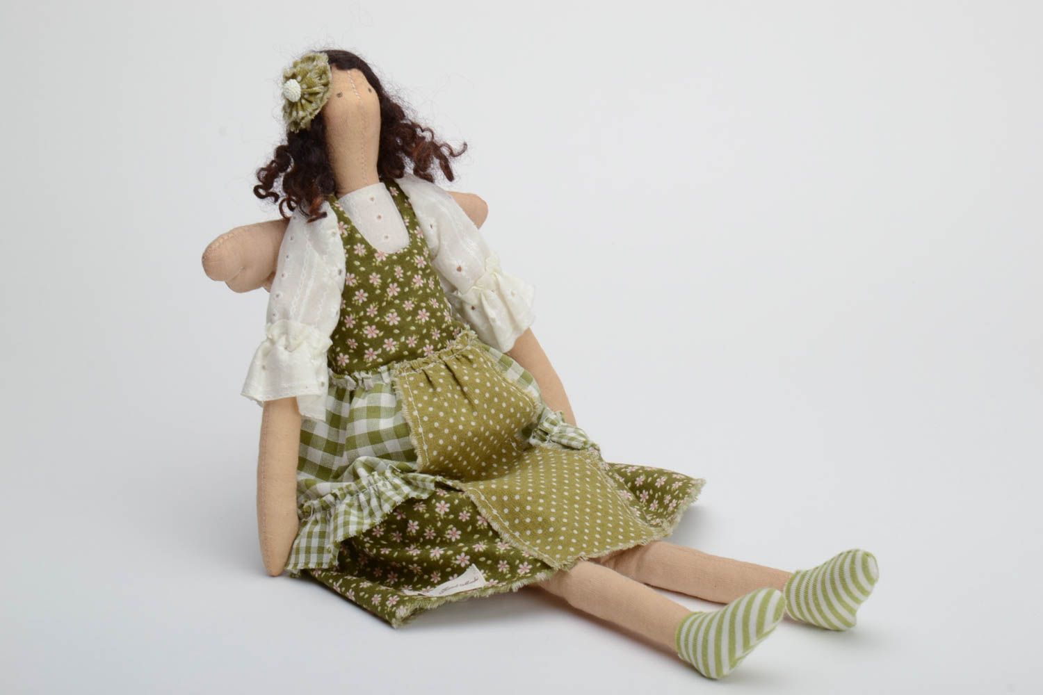 Handmade soft doll sewn of natural fabrics with curly hair in green dress photo 2
