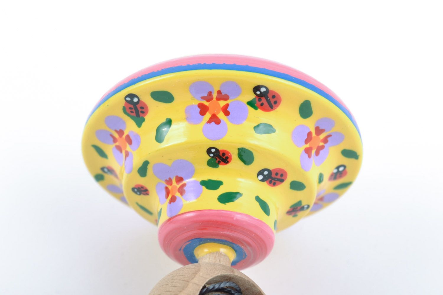 Handmade educational wooden eco toy spinning top painted in yellow color palette photo 4