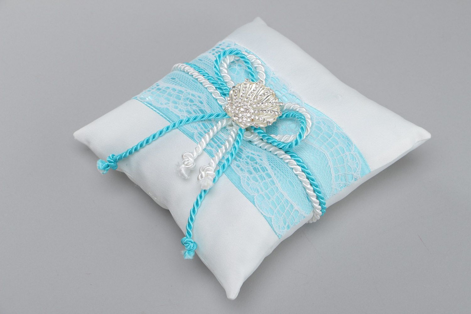 White handmade ring pillow sewn of satin with lace and decorative seashell photo 2