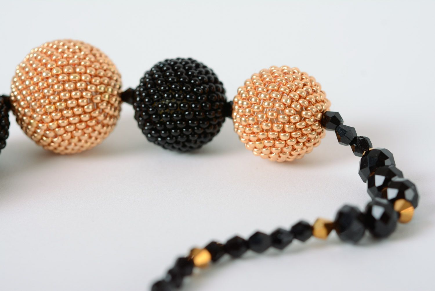 Elegant necklace with balls woven over with beige and black beads for women photo 4