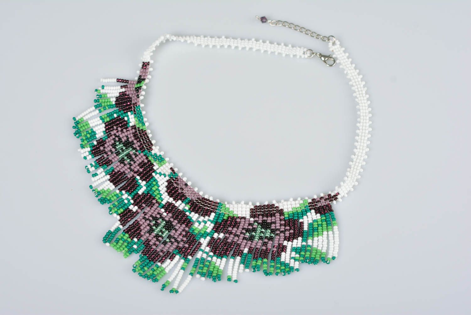 Handmade beaded necklace fringe with purple flowers on white  photo 1