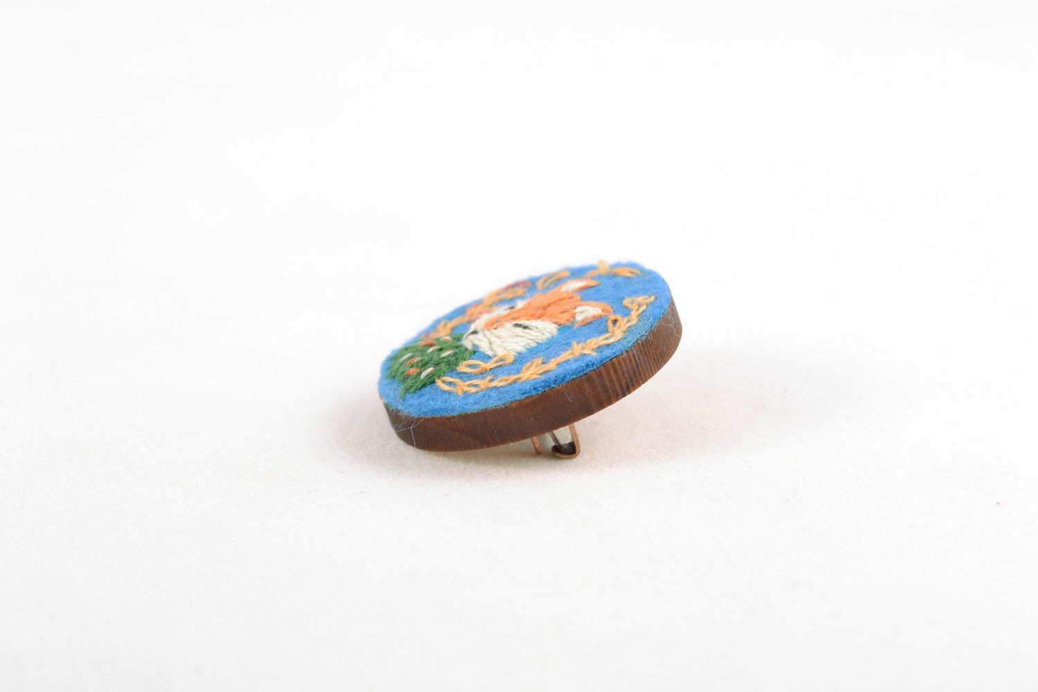 Round brooch with embroidery on wooden basis photo 5