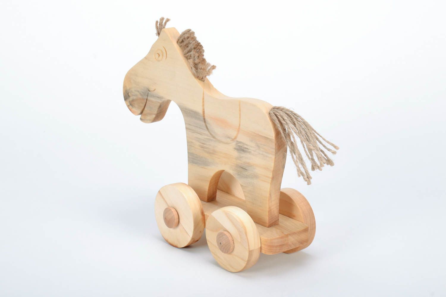 Holzspielzeug Pferd auf Rädern foto 2