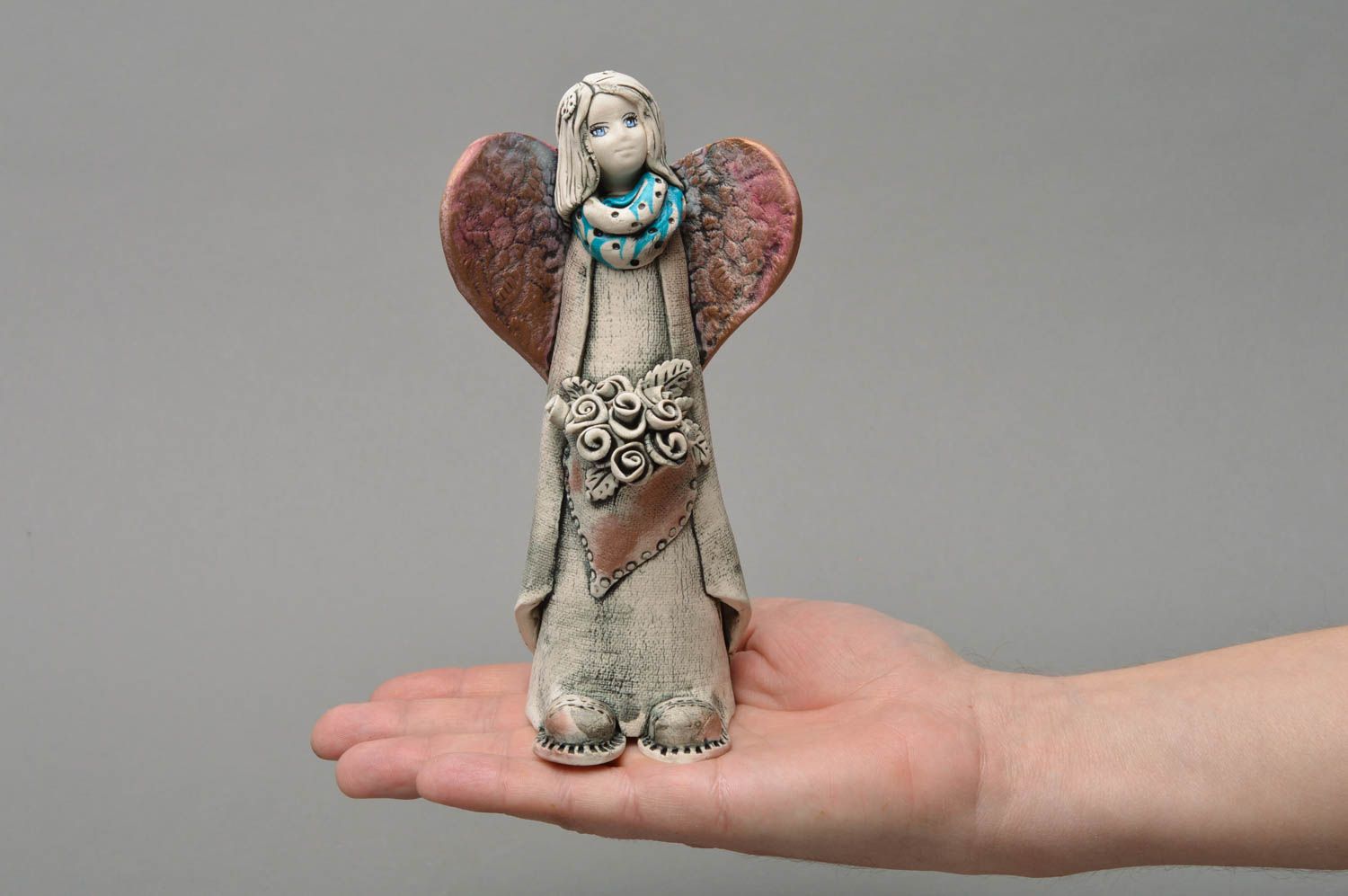 Handmade beautiful colorful small porcelain figurine of angel with flowers photo 4