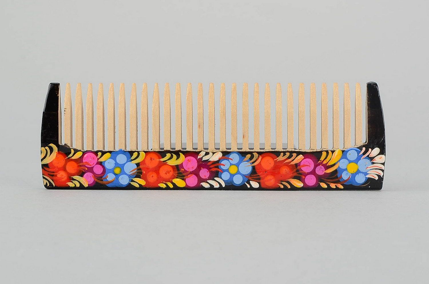 Wooden comb with painting photo 3