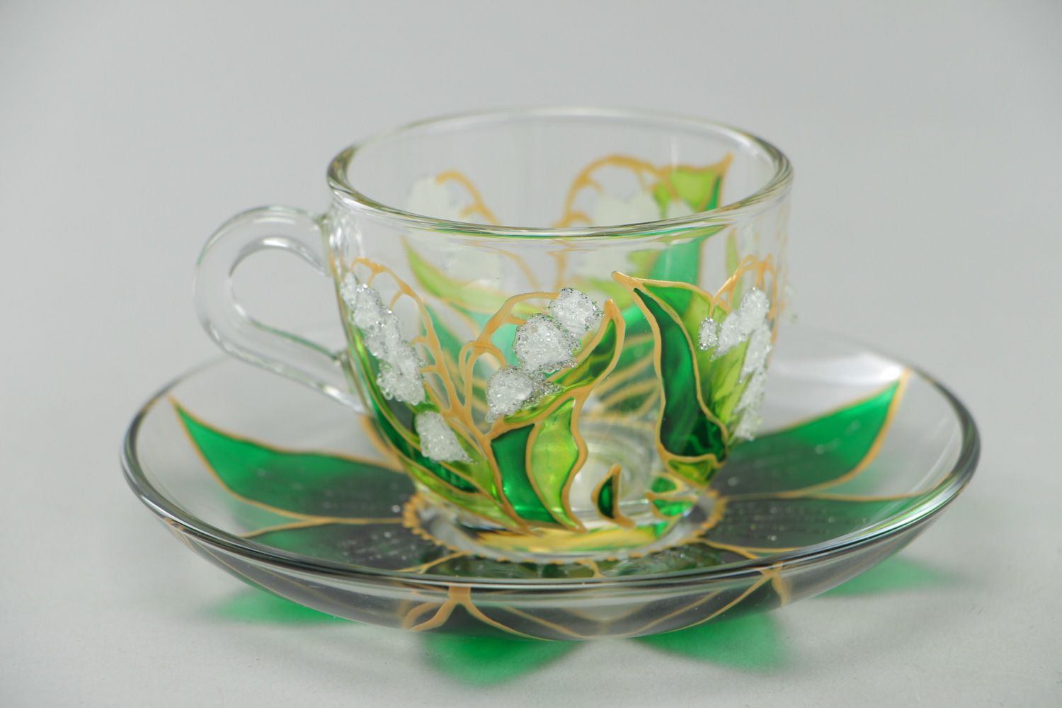 Unique clear glass teacup with hand-painted gold and green floral pattern photo 1