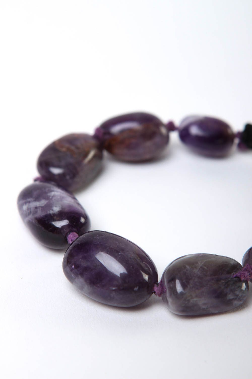 Strand bead gemstone bracelet with black cord and dark blue stone beads photo 3