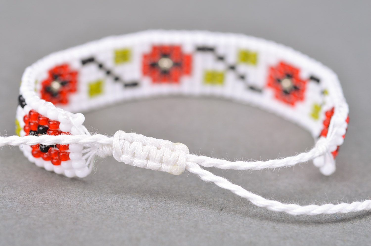 Handmade ethnic wrist bracelet woven of beads in white and red colors for women photo 5