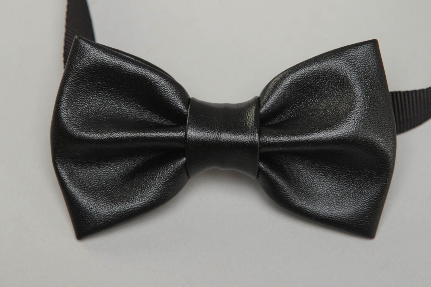 Black bow tie made of leather fabric photo 2