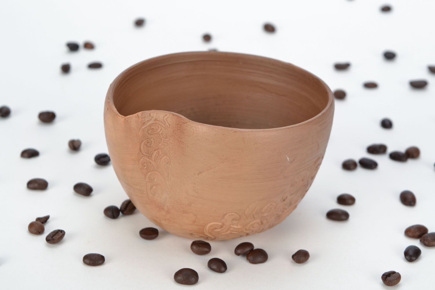 Clay not glazed cup for left-handed people with rustic decor photo 1