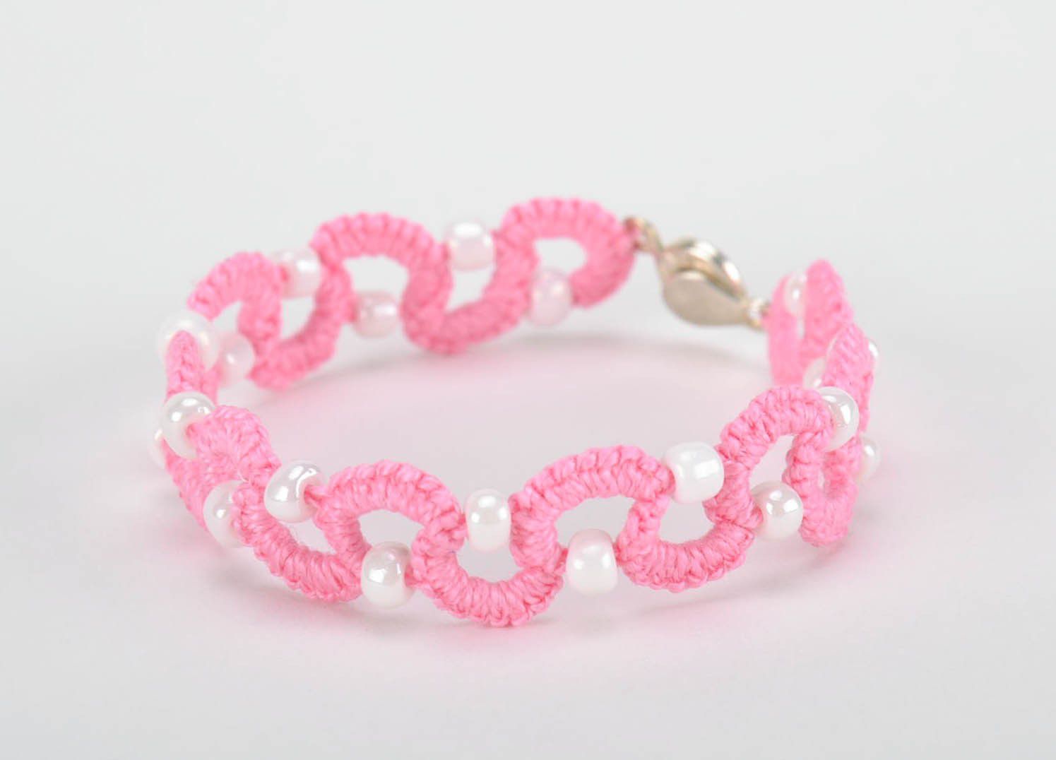 Bracelet braided from cotton threads white and pink photo 1