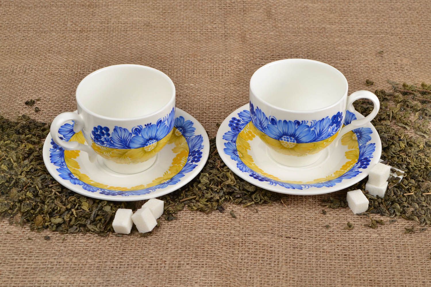 Set of 2 two teacups in white, blue, and yellow colors with saucers photo 1
