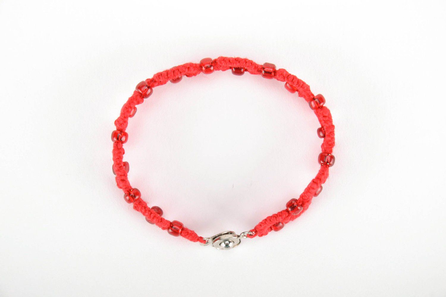 Red bracelet made from cotton threads photo 2