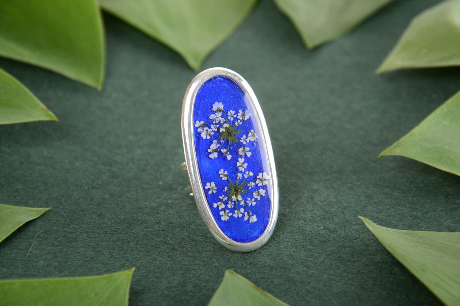Beautiful massive handmade blue epoxy resin ring with dried flowers photo 1