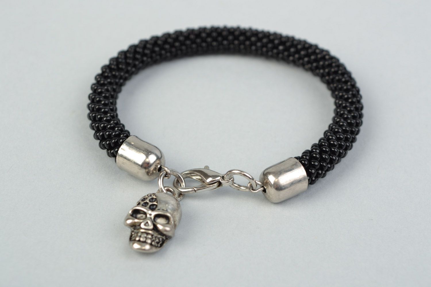 Handmade beaded cord women's wrist bracelet in black color with skull charm photo 4