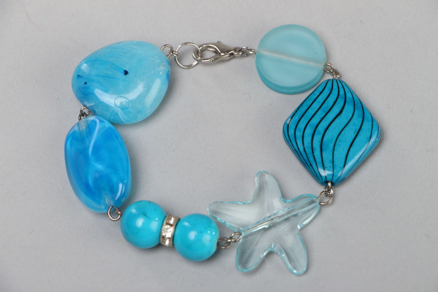 Handmade light blue wrist bracelet with plastic beads in marine style for women photo 1