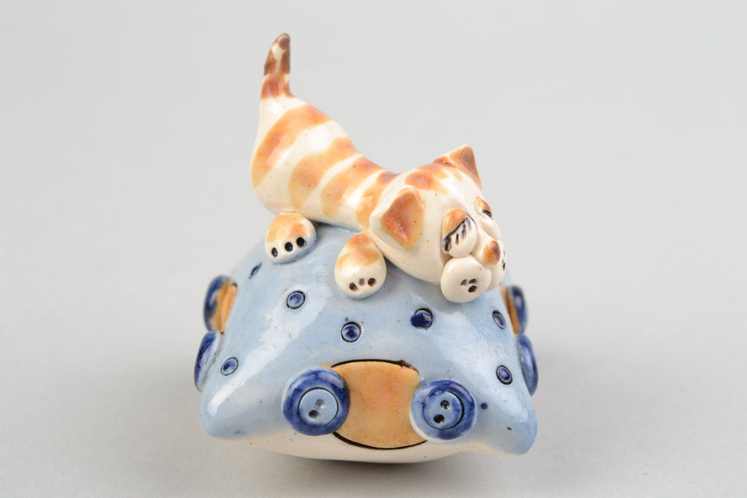Handmade designer miniature ceramic figurine of cat on pillow painted with glaze photo 1