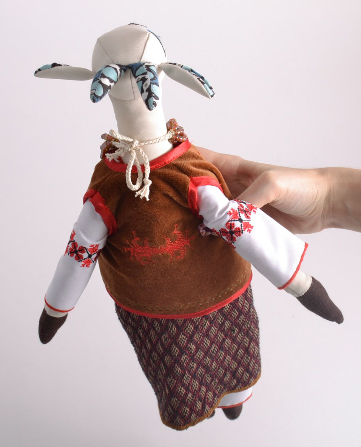 Handmade designer soft toy sewn of fabric tall goat in ethnic clothing photo 5