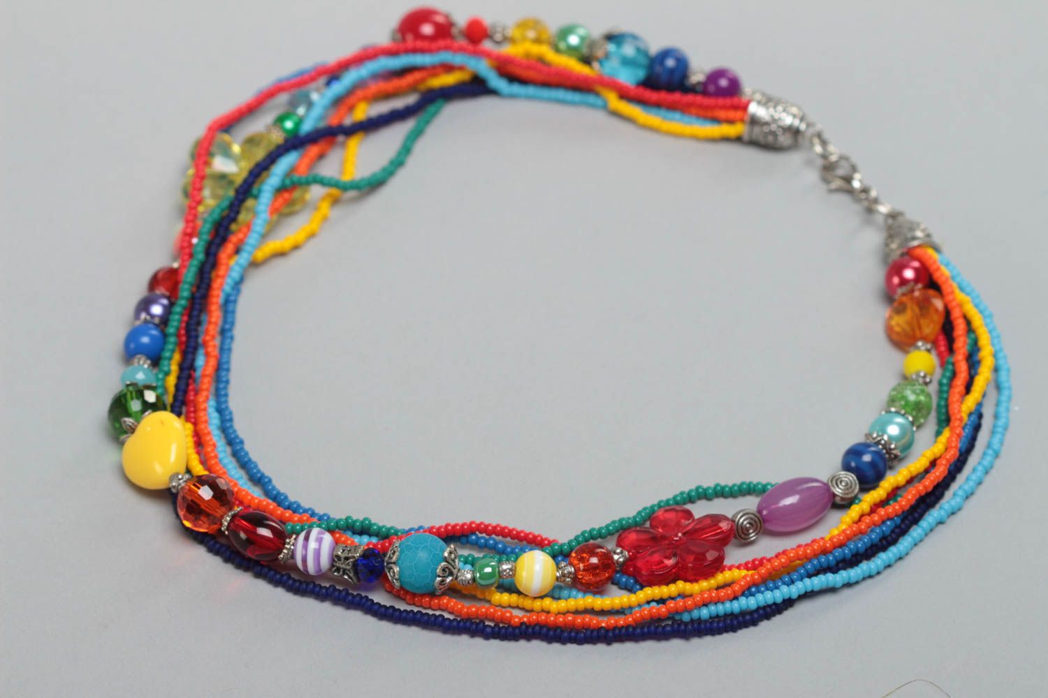 Beautiful handmade children's beaded necklace with glass and plastic beads photo 2