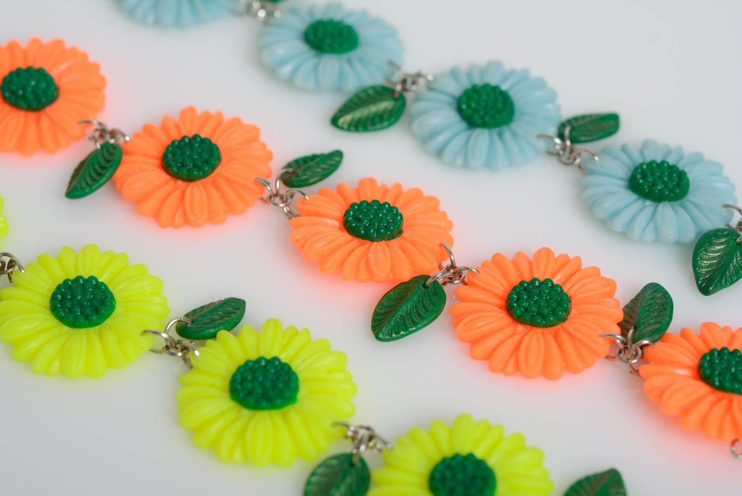 Set of handmade designer plastic flower bracelets 3 pieces yellow orange and blue photo 3