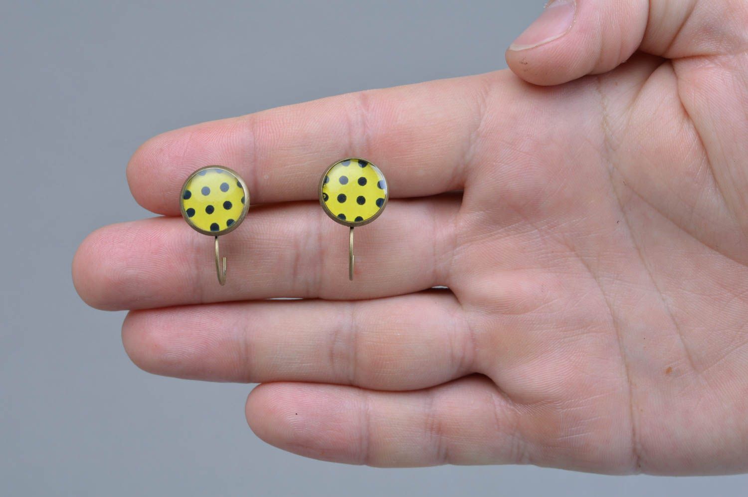 Handmade designer decoupage epoxy earrings of yellow color with black dots photo 4