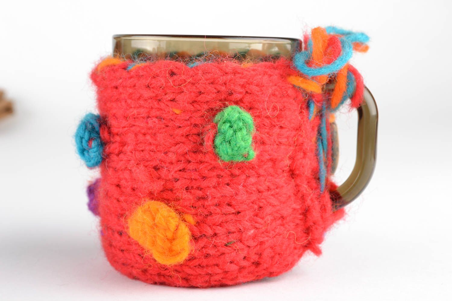 Glass cup with red crochet cozy photo 1