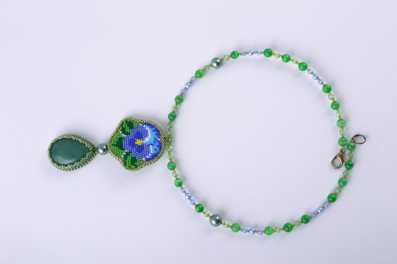 Handmade women's necklace embroidered with beads and natural stones with charm photo 4