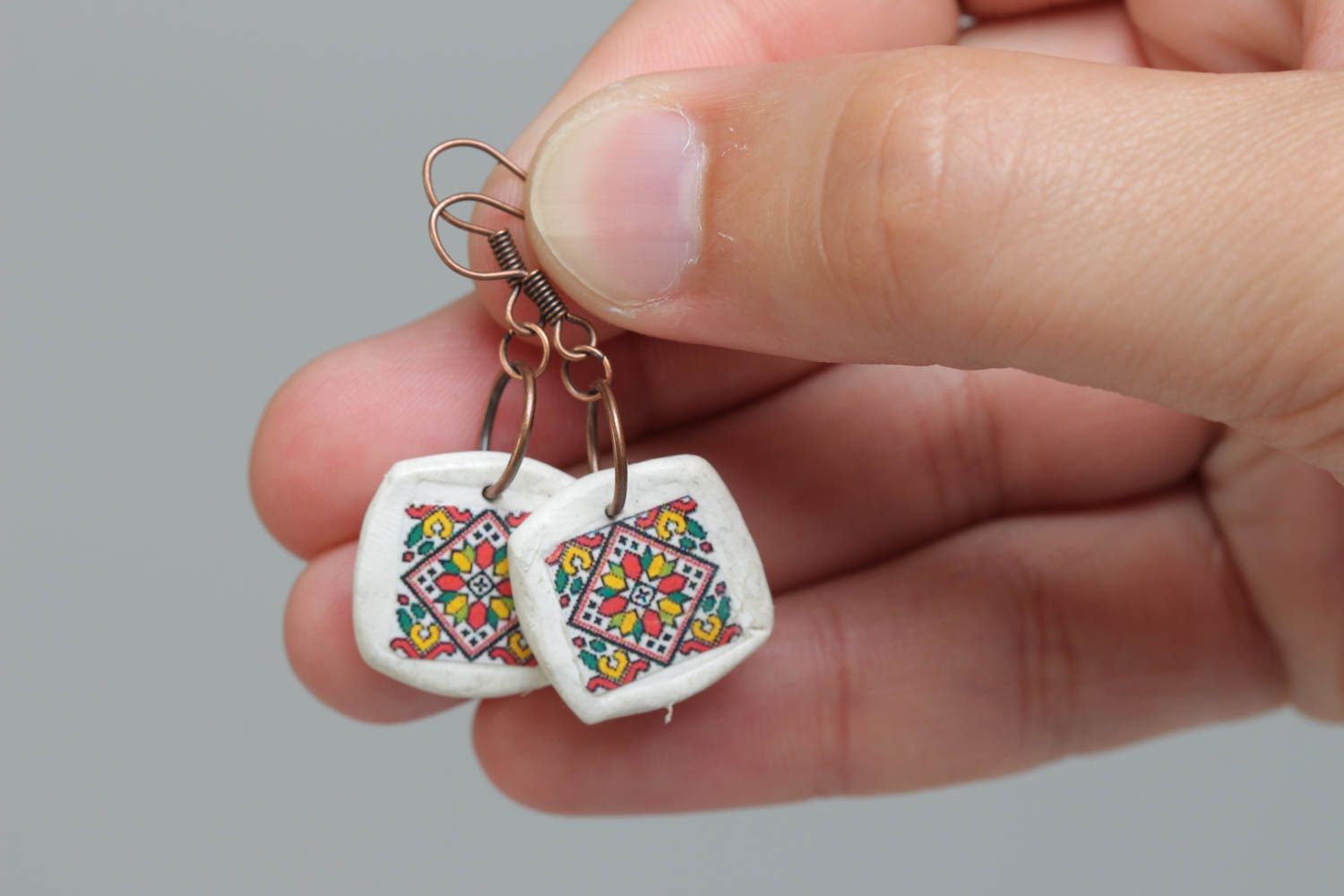Handmade designer white earrings with Ukrainian symbolism made of polymer clay photo 5