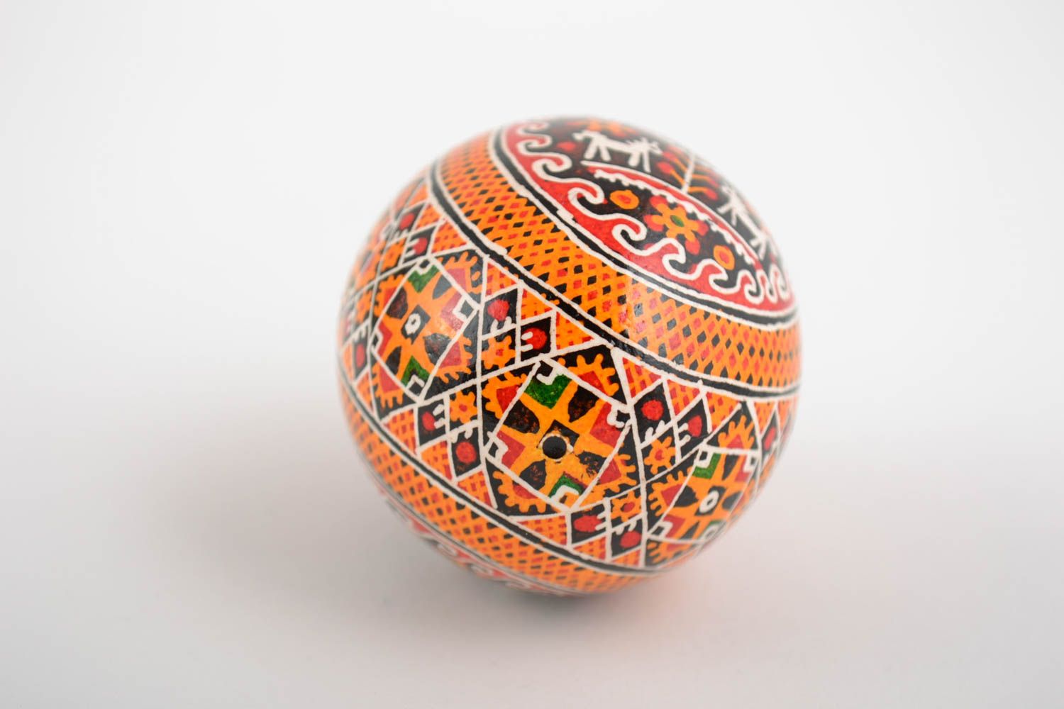 Handmade painted Easter egg with pattern in orange color palette home decor photo 5