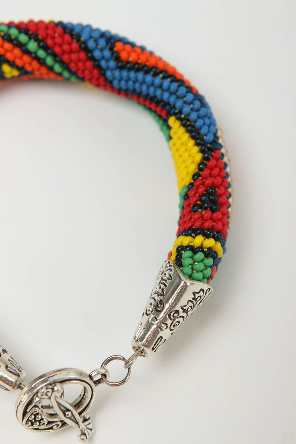 Handmade beaded cord bracelet in geometric style and metal fittings photo 4