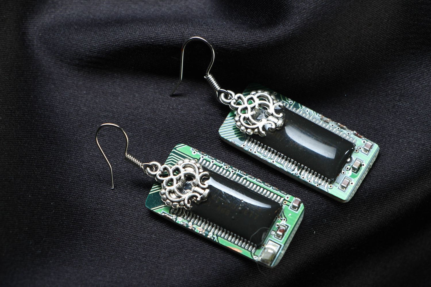 Designer metal earrings with microchips in cyberpunk style photo 1