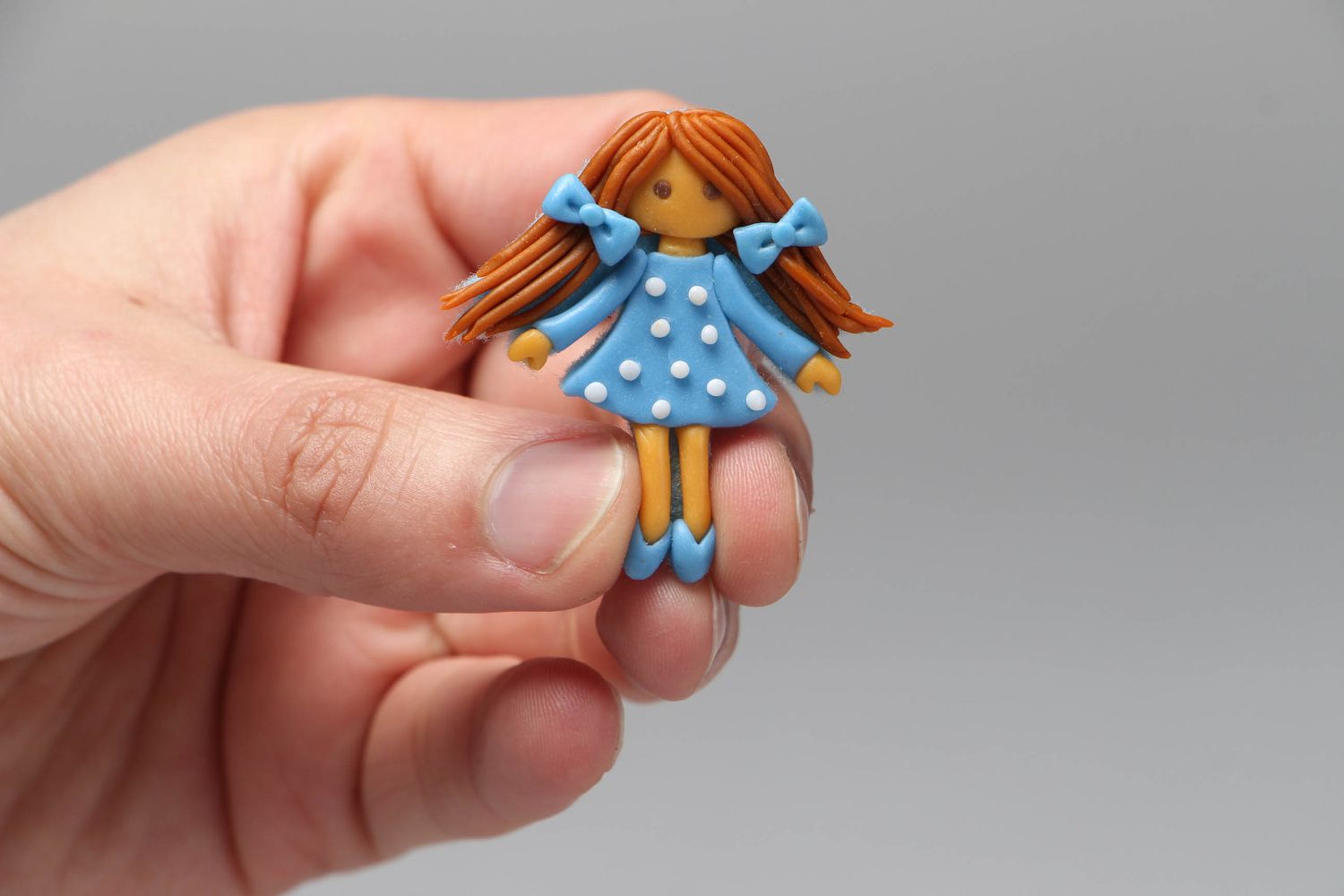 Plastic brooch in the shape of doll Drops photo 4