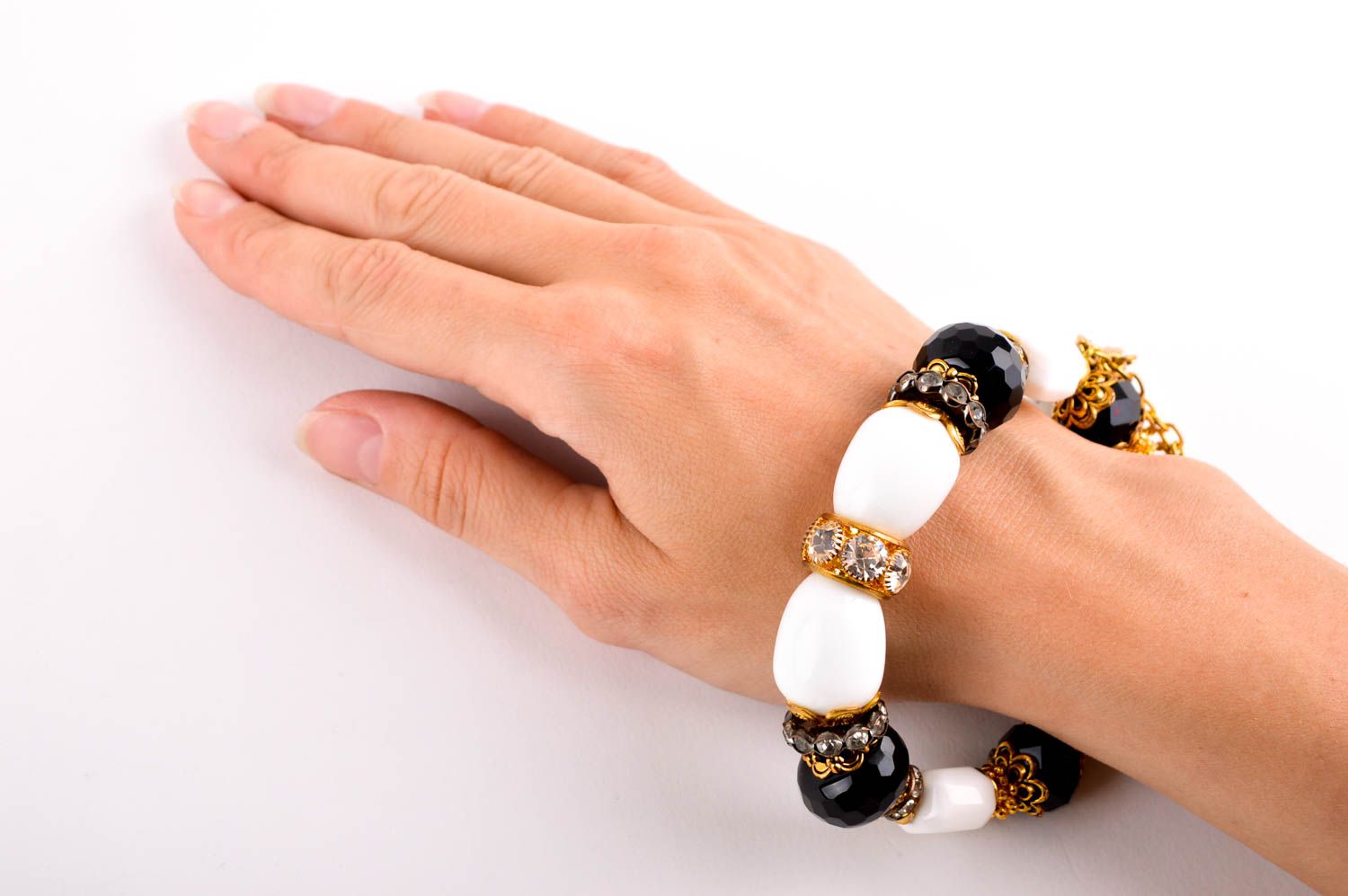 Handmade gemstone beaded bracelet with black and white beads and gold color charms for girls photo 5