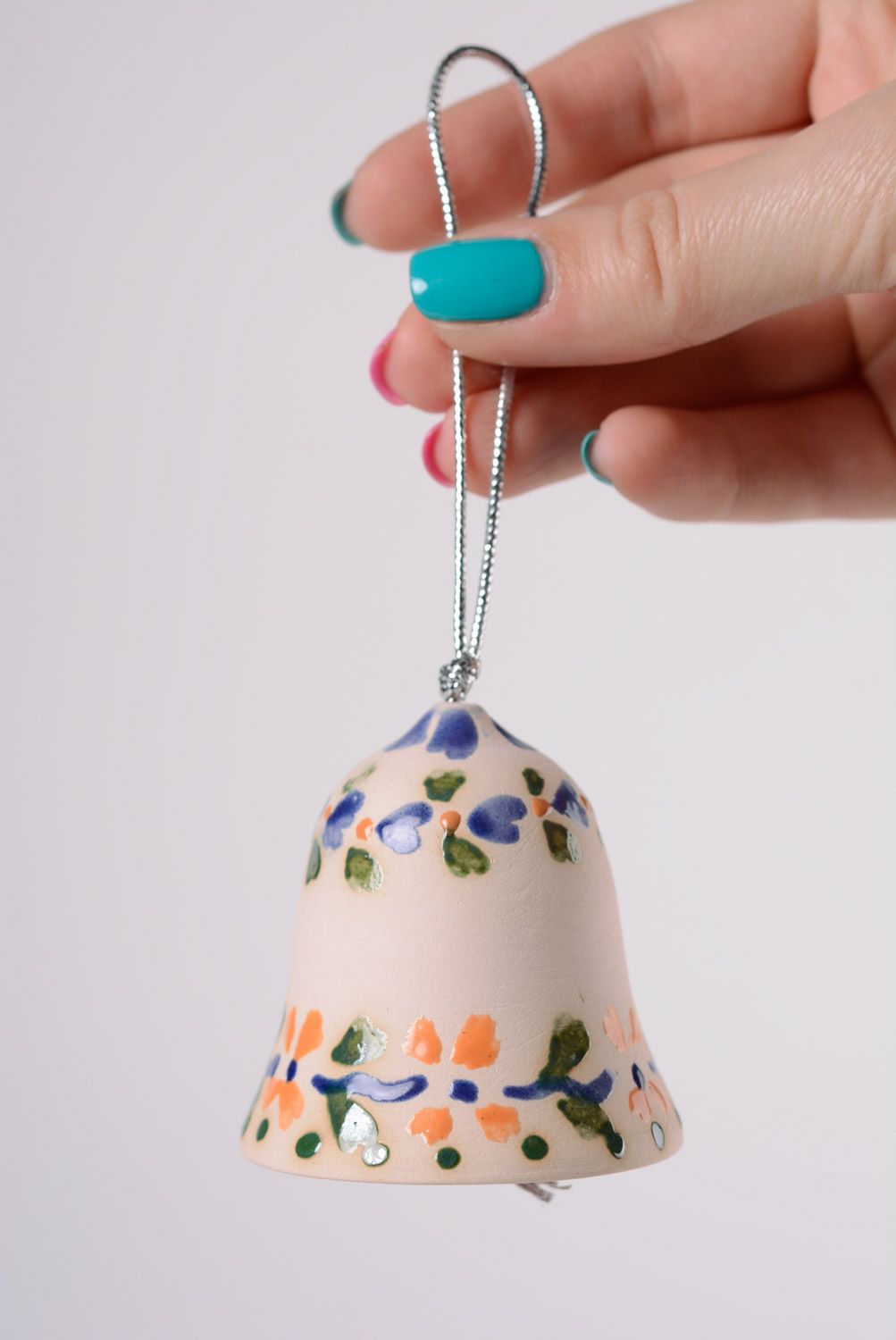 Handmade decorative light maiolica ceramic hanging bell ornamented with glaze photo 2